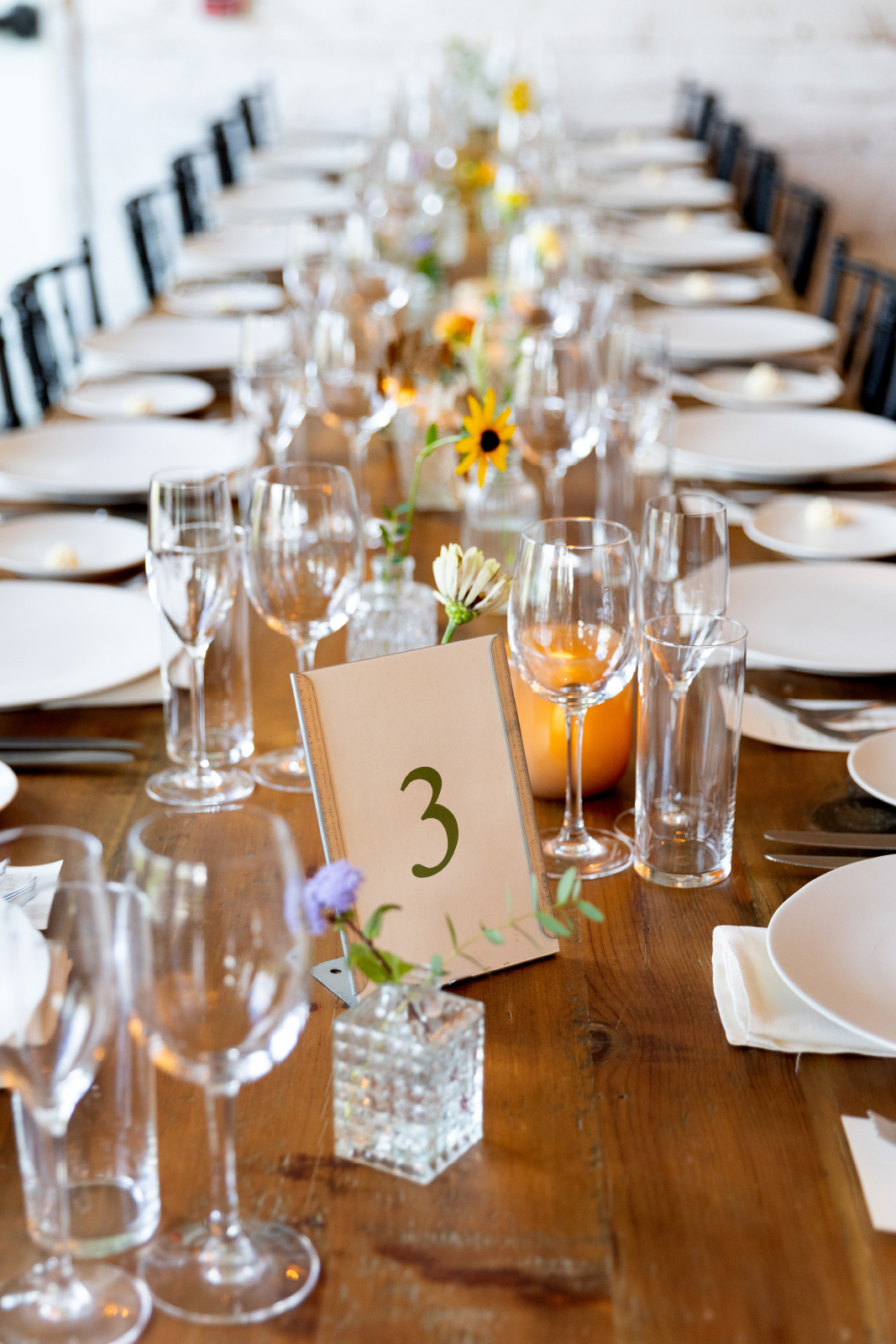 Terrain Gardens at Devon Yard wedding venue PA wooden farm tables at reception 