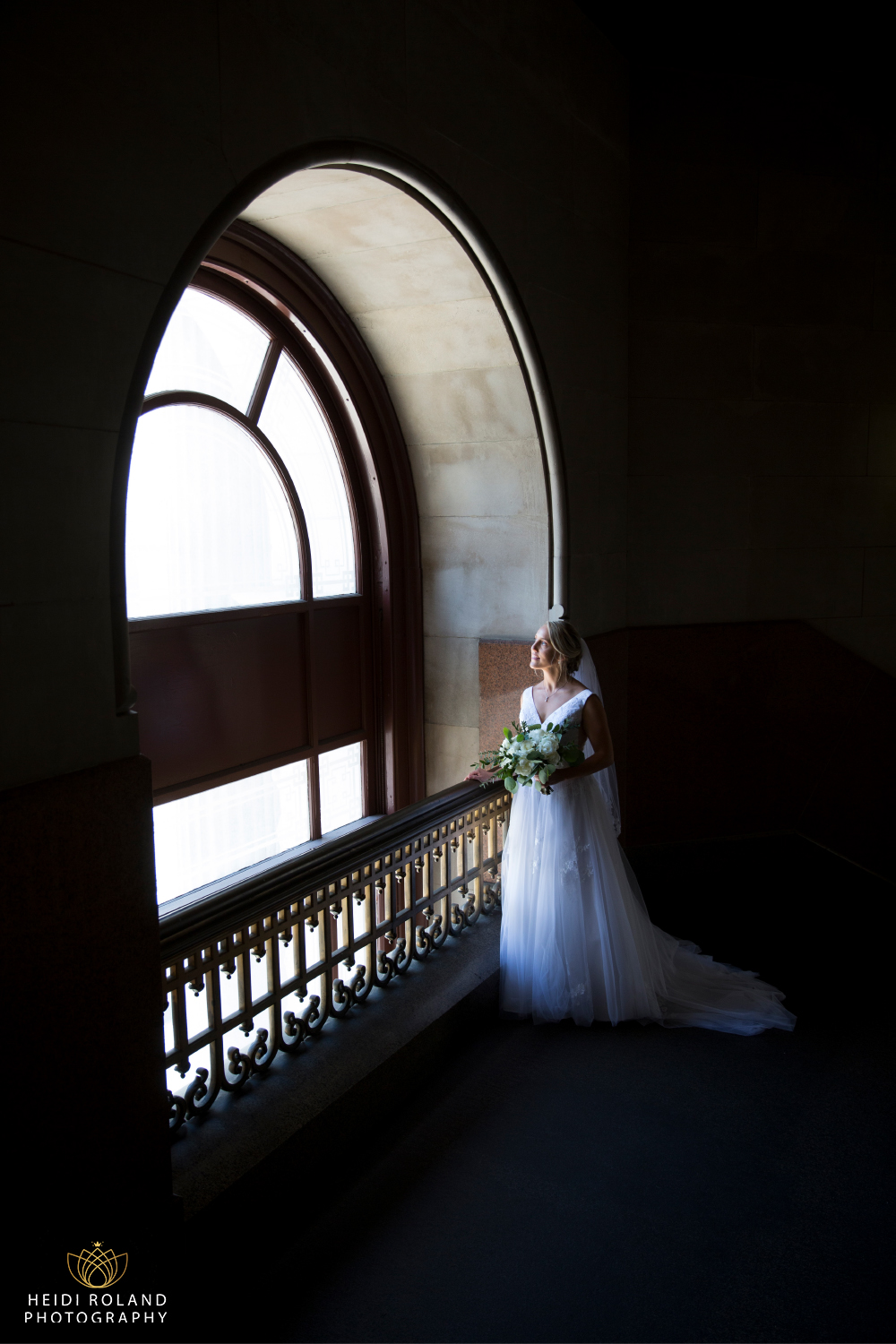 bride by big window