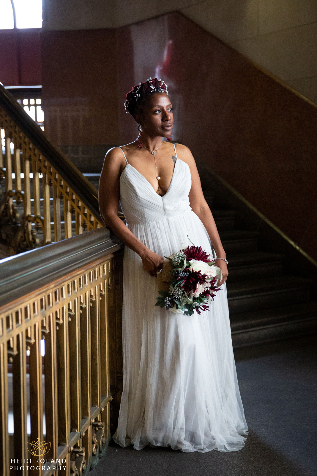 bride in window light Philadelphia City Hall Stairway
