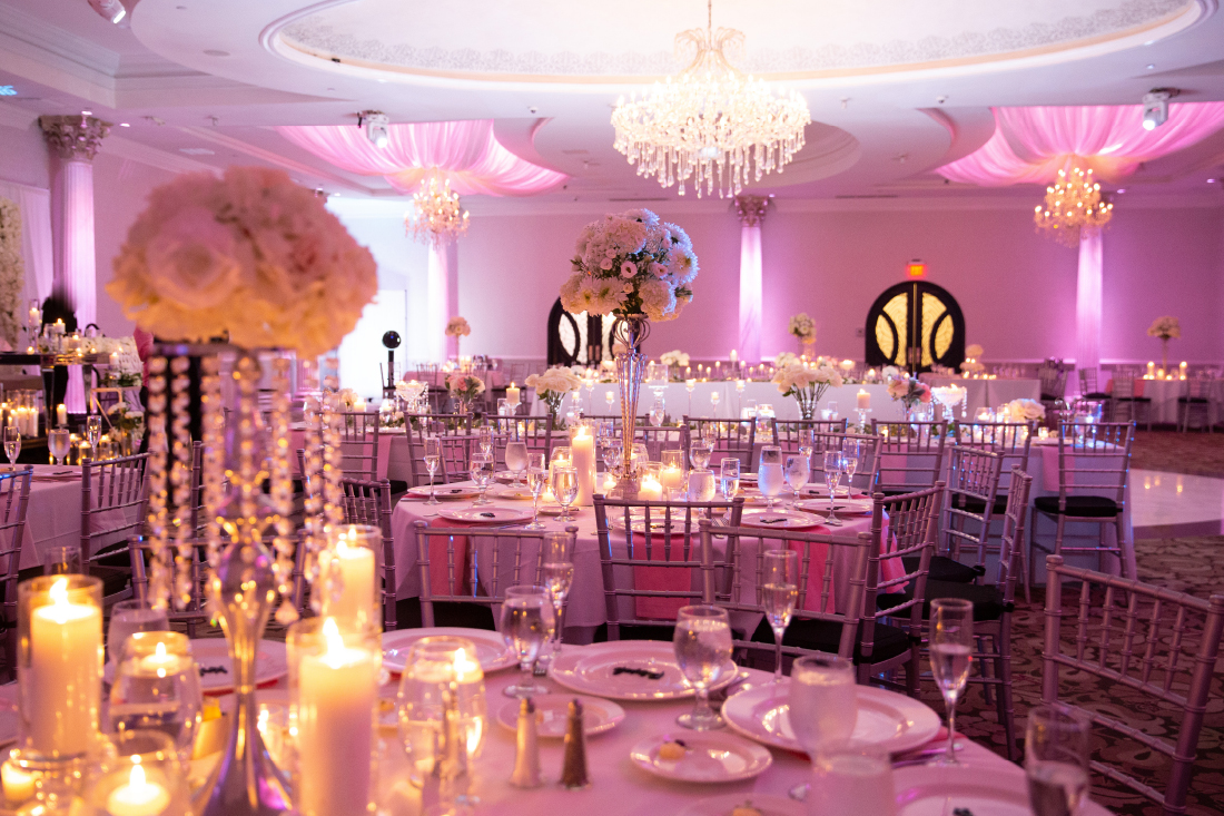 The Waterfall Ballroom Wedding Reception with pink uplighting
