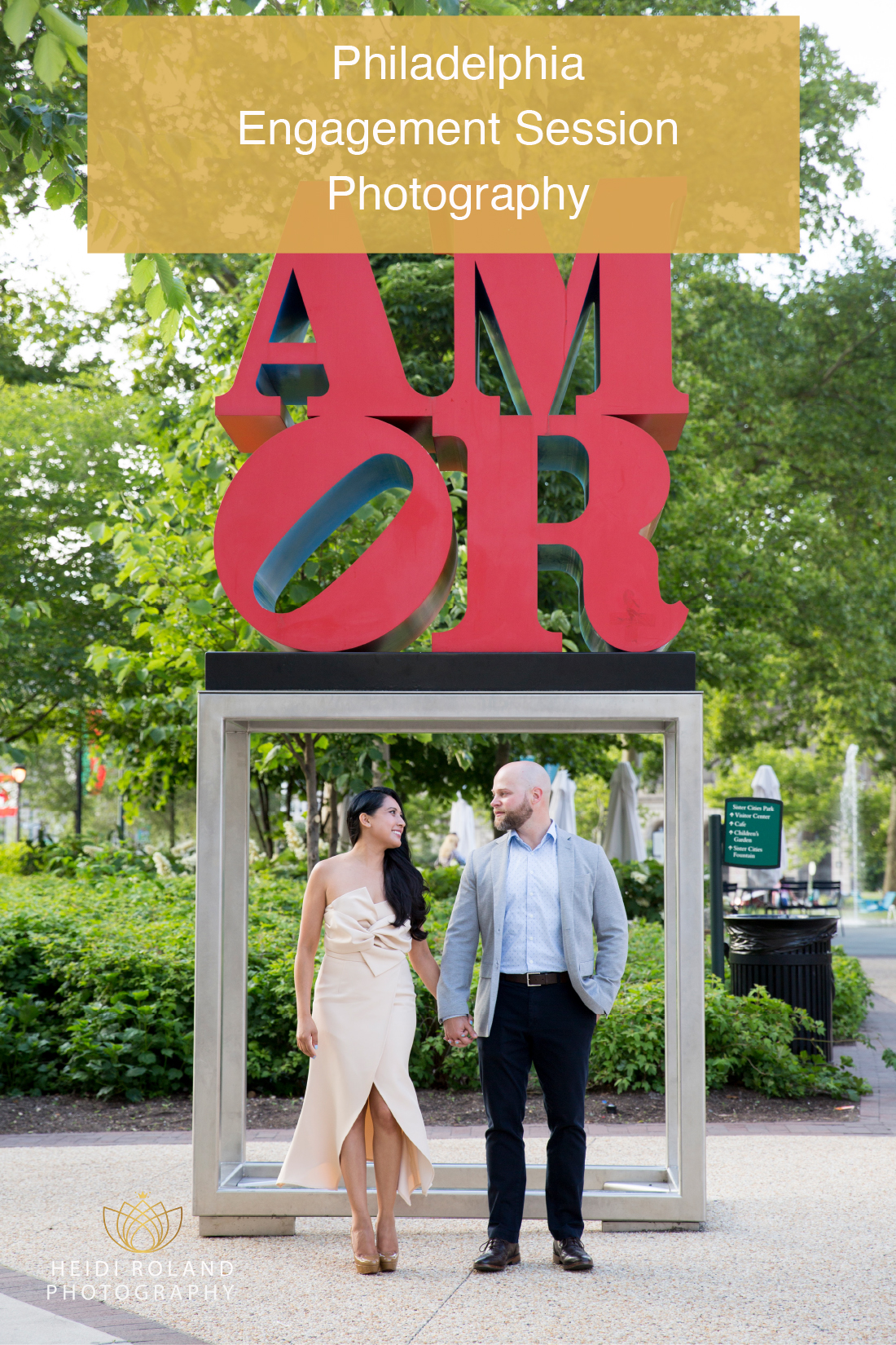 couple in front pf amore sign in Philadelphia Engagement photos