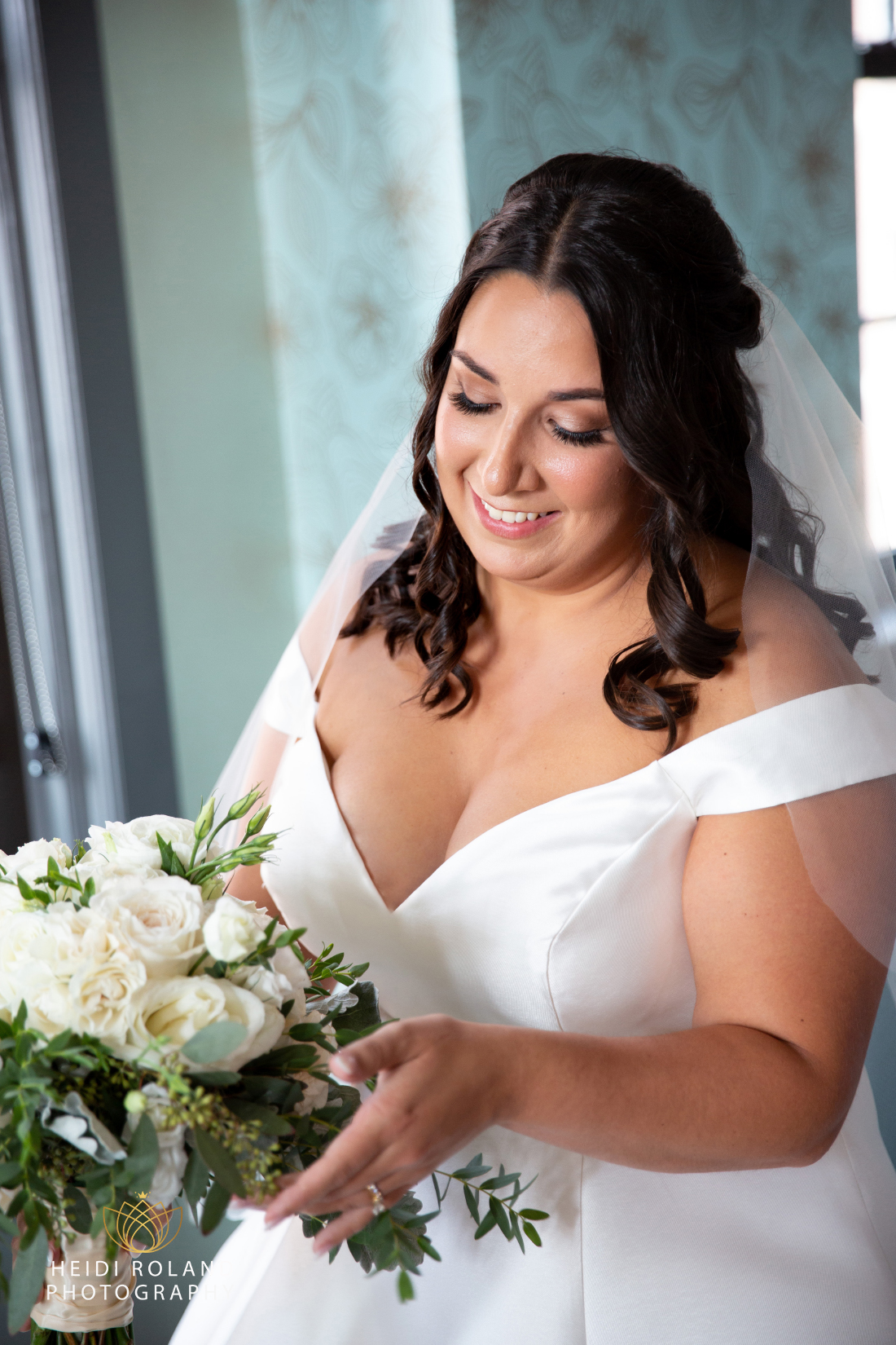 bride with her white rose bouquet on her wedding day in Philly 
