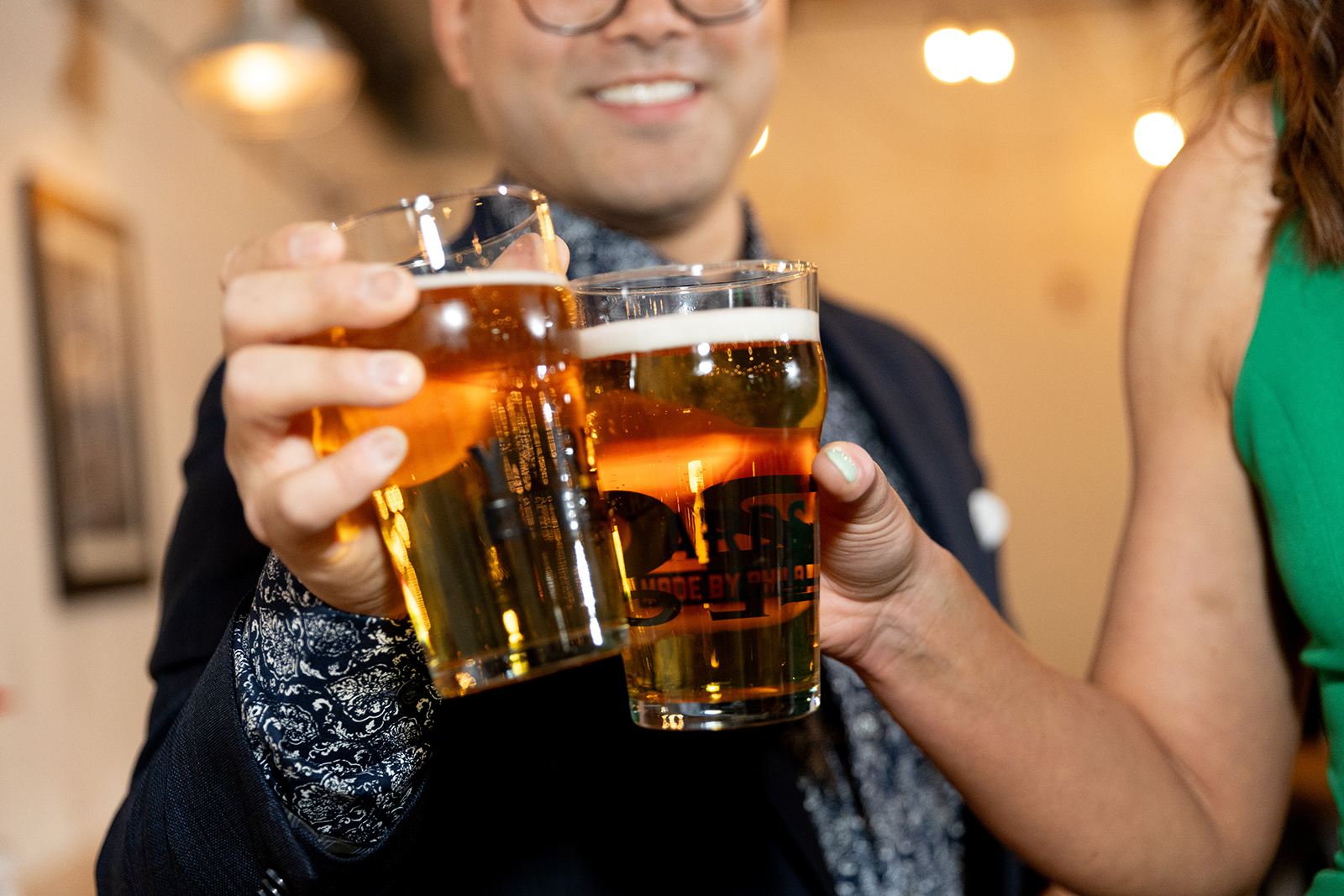 couples cheer with their beers at Philadelphia Brewery Wedding Venues